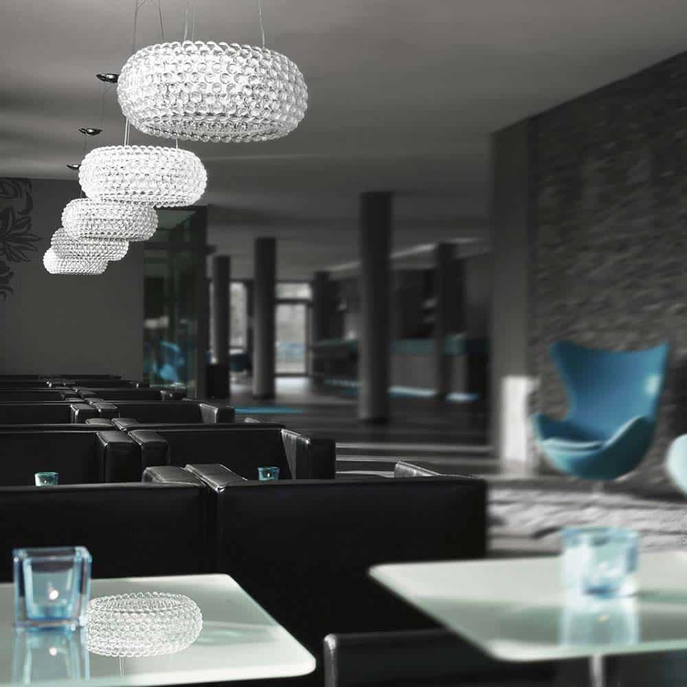 Caboche Plus Media Lampada da Sospensione Trasparente Ambientata in Hotel Foscarini Prisma Light