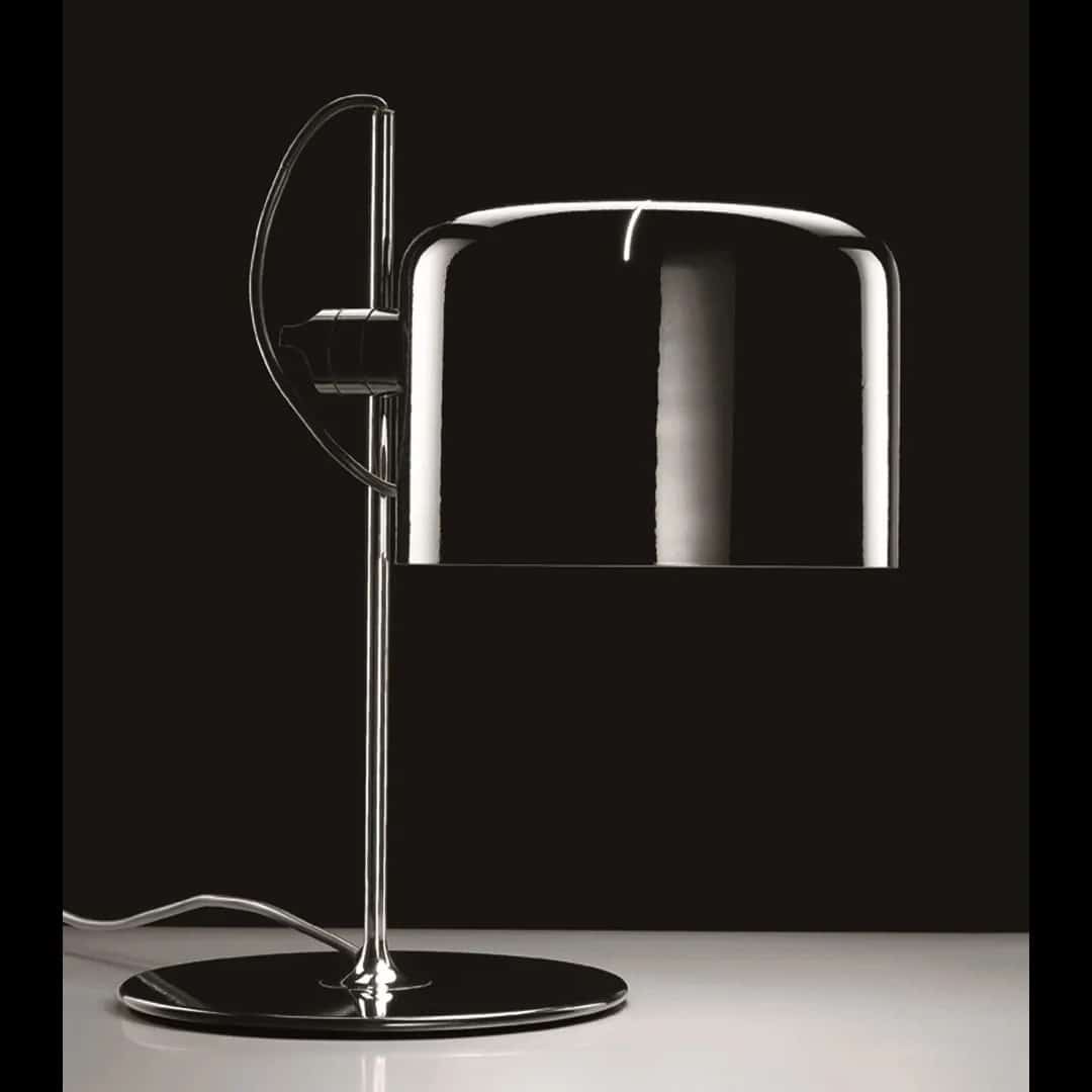 Coupe-2202-lampada-da-tavolo-Oluce-Designer-Joe-Colombo-1967-finitura-nero-lucido-Prisma-Light.jpg